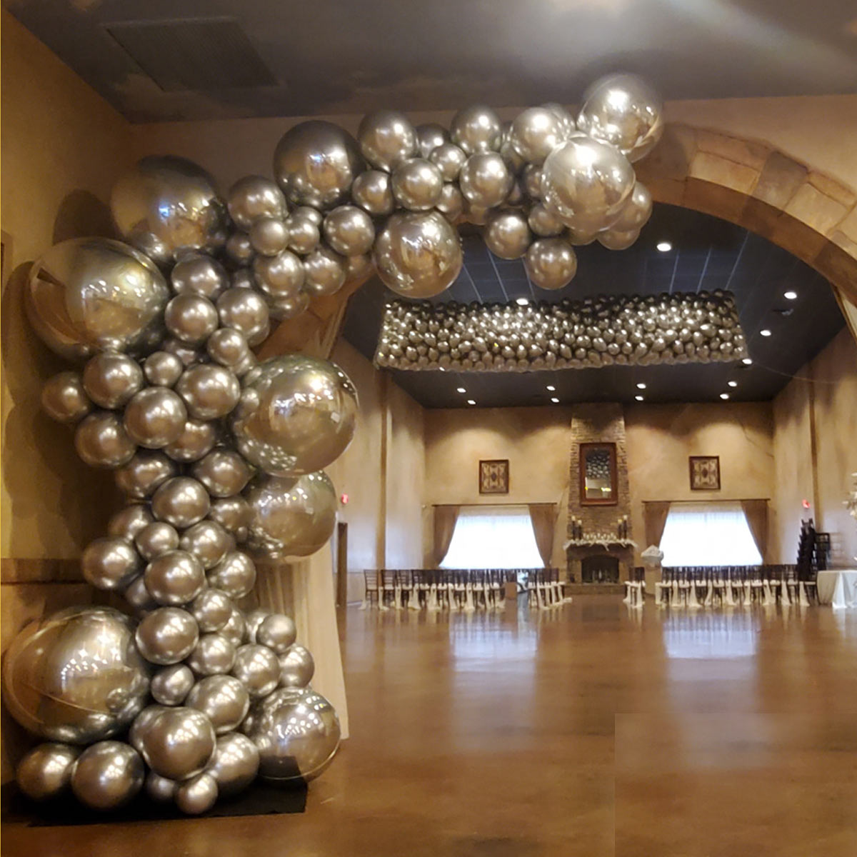 Demi-Arch-by-Airheads-Balloon-Art Organic Demi Arch and balloon drop at wedding venue entrance