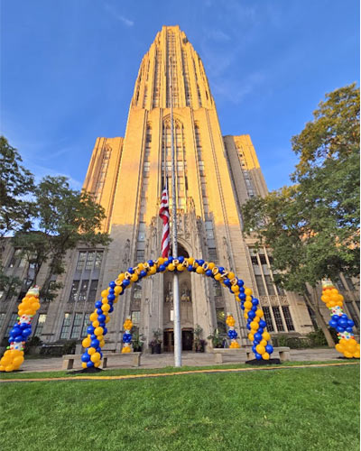 Cathedral-of-learning-arch Blue and gold outdoor balloon arch and columns at the University of Pittsburgh Cathedral of Learning.